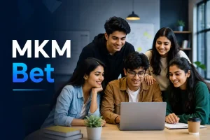 Five Indian Gen Z professionals collaborating around a laptop in a modern office, representing the MKM Bet guide with a clean, editorial-style website banner and minimal design.
